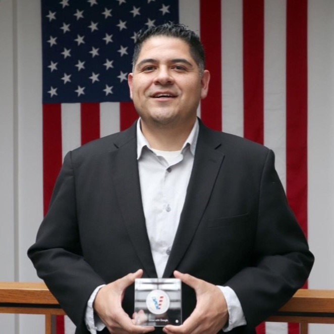 Professional headshot of Julian Gutierrez